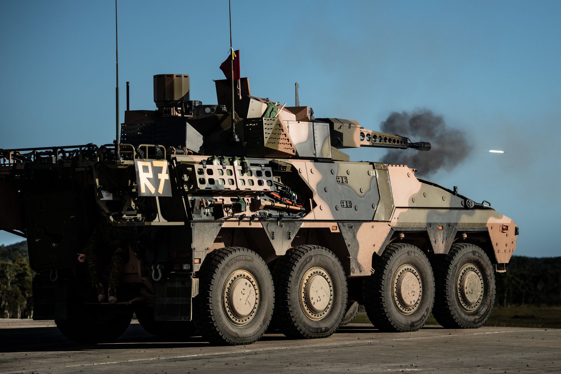 An Australian Army Boxer Combat Reconnaissance Vehicle fires its 30 mm main armament during live-fire training at Wide Bay Training Area in Queensland. (Picture source: Australian MoD)