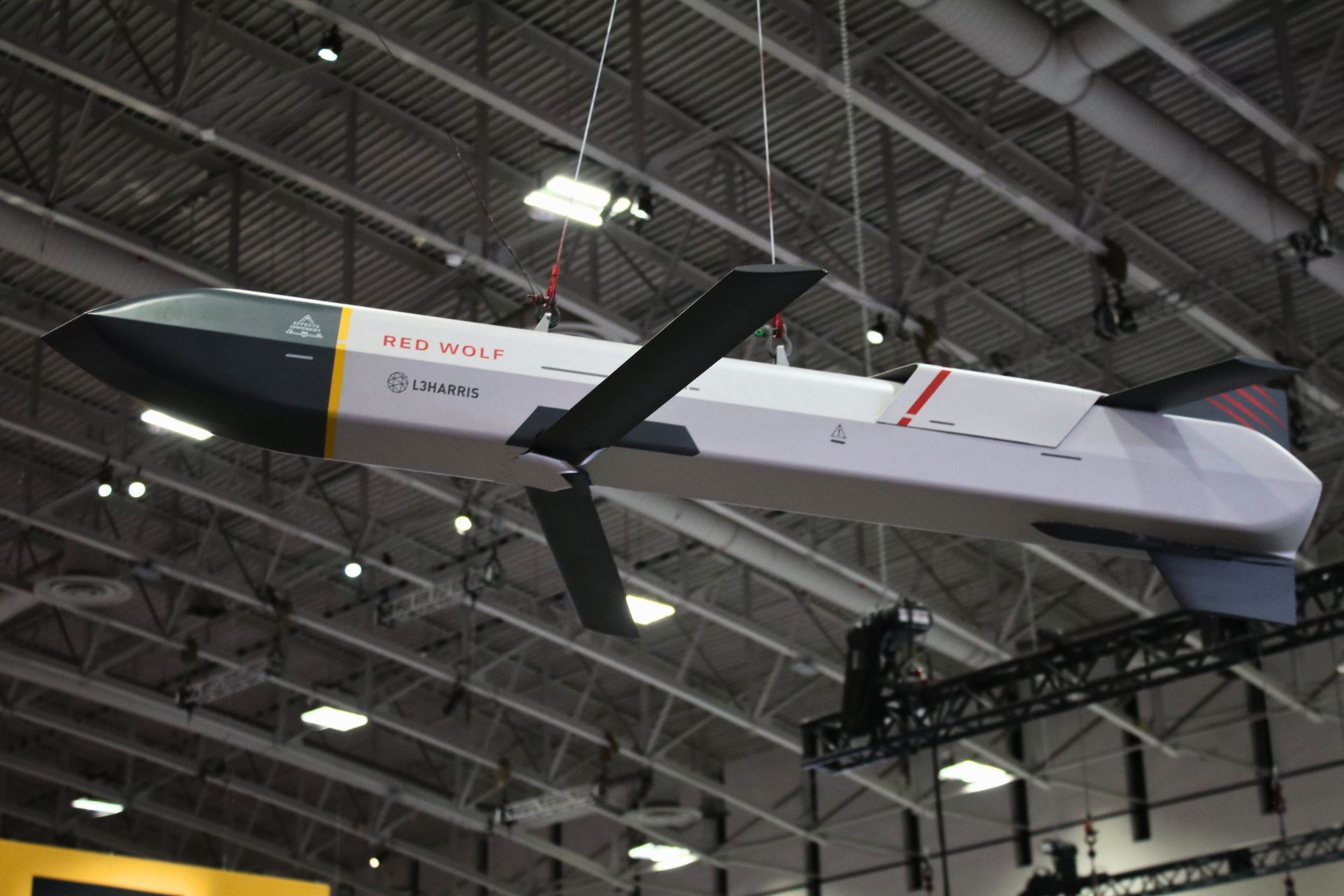 The L3Harris Red Wolf long-range precision strike missile displayed at AUSA 2026, designed to engage distant targets and recently flight-tested from a U.S. Army MH-60 Black Hawk helicopter. (Picture source: Army Recognition)