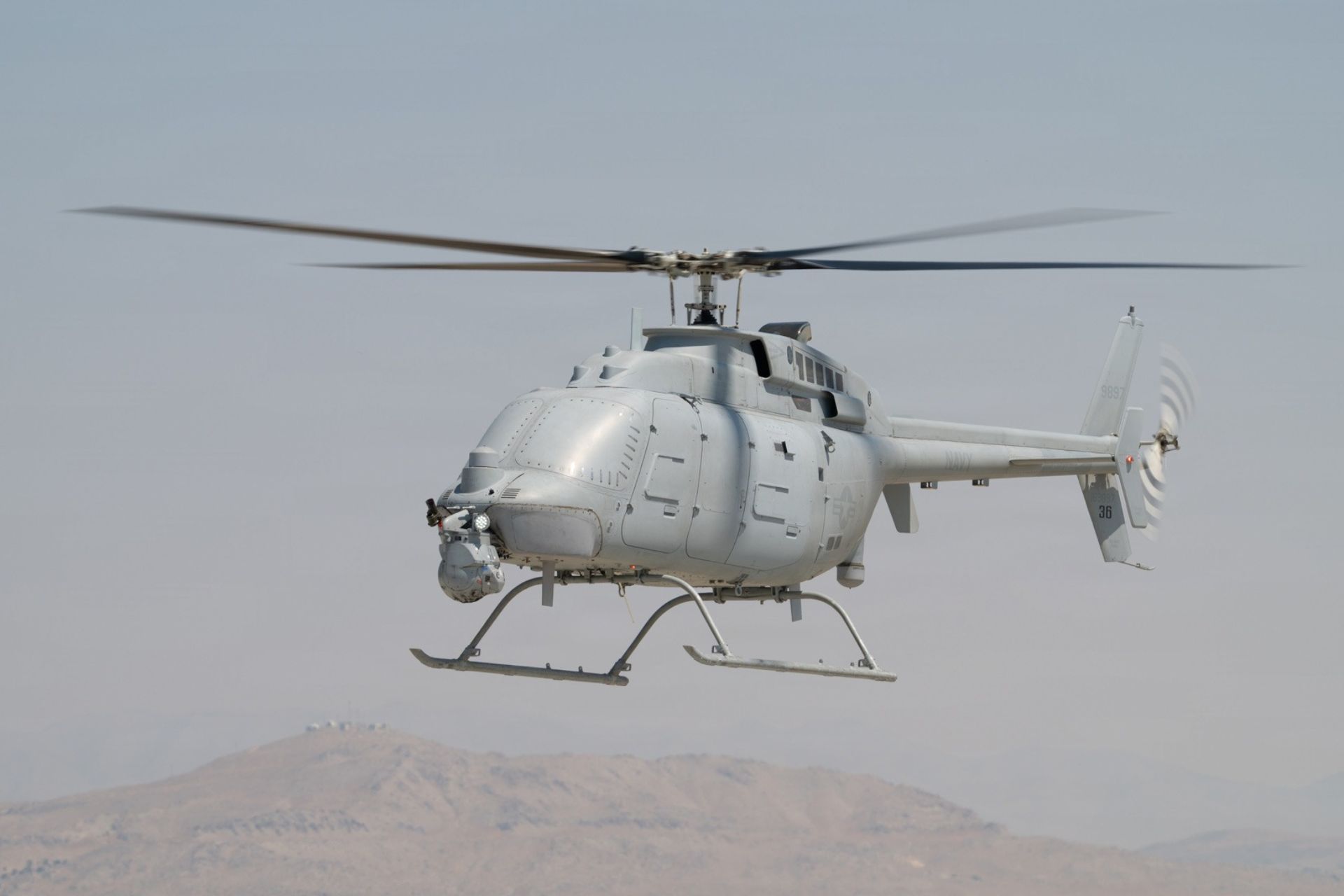 A U.S. Army MQ-8C Fire Scout unmanned helicopter hovers during initial flight testing at Michael Army Airfield in Utah, as the service prepares the aircraft to evaluate airborne reconnaissance and targeting sensors. (Picture source: US DoD)