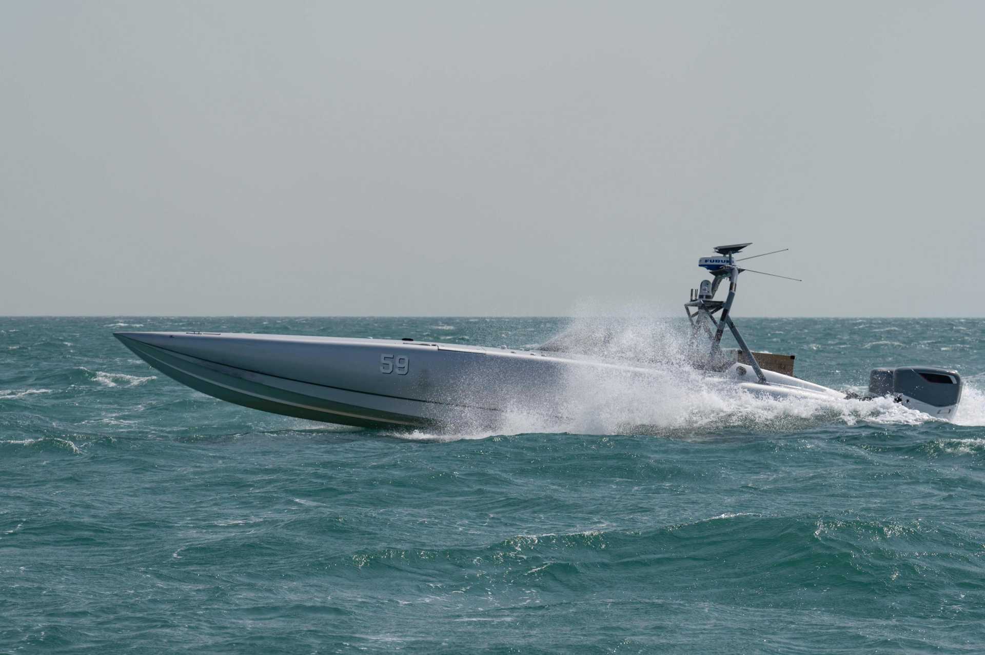 A U.S. Navy unmanned surface vessel equipped with an aerial missile system operates during Exercise Digital Talon 3.0 in November 2024. The Pentagon's new SWAP-USV Sprint 2 competition seeks production-ready autonomous boats capable of engaging hostile drones and helicopters using Hellfire, JAGM, APKWS, Stinger, or other mature weapons. (Picture source: U.S. Department of War/Defense)