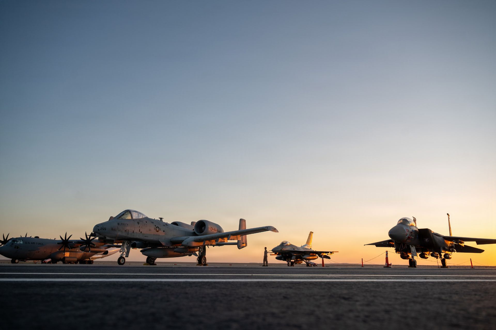 A U.S. Air Force C-130J Super Hercules, A-10 Thunderbolt II, F-16 Fighting Falcon and F-15E Strike Eagle are displayed at El Alamein Airport in Egypt during the 2026 El Alamein International Airshow, which brings together more than 80 participating countries to present aviation technologies and discuss operational capabilities and cooperation. (Picture source: US DoD)