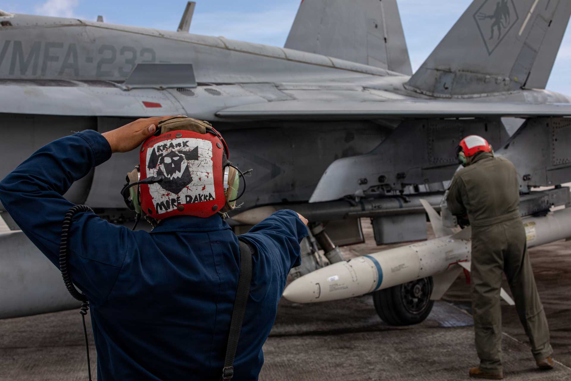 U.S. Marine Corps Cpl. Antonio Barrios, left, and Sgt. Ruben Medina, both aviation ordnance technicians with Marine Fighter Attack Squadron (VMFA) 232, Marine Aircraft Group 12, 1st Marine Aircraft Wing, secure an AGM-88 HARM during an Aviation Training Relocation program at Andersen Air Force Base, Guam, Feb. 5, 2026.