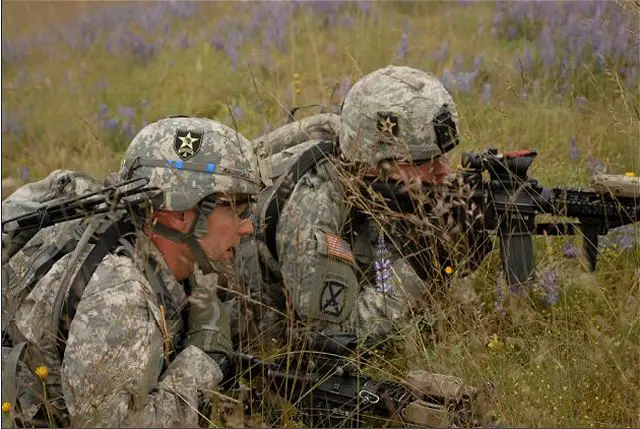 Sgt. Joseph MacDonald (left), a squad leader with 2nd Platoon, Company C, 4th Battalion, 9th Infantry Regiment, communicates with a member of his squad during a practice run prior to a platoon live-fire evaluation June 22, 2011.