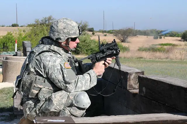 U.S. Army Pvt. Samuel Carlson fires a paint round from an M320 grenade launcher during training at Fort Hood, Texas. (Credit photo U.S. Army)