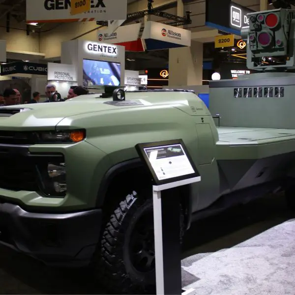 GM Defense's new unmanned ground vehicle (UGV), based on the Chevrolet Silverado 3500 Heavy Duty, was displayed at AUSA 2026 with Scout AI's Gx Ground Agent autonomous driving system, the LOCUST X3 counter-drone laser weapon, and the Squarehead Discovair G2+ acoustic drone detection sensor. (Picture source: Army Recognition Group)