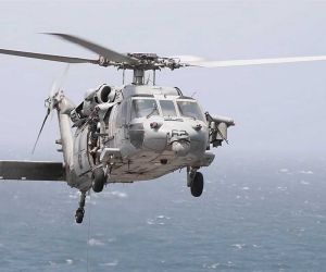 U.S. Navy MH-60R Seahawk armed with AGM-114 Hellfire missiles, illustrating the type of naval helicopter capability used by CENTCOM to intercept and disable the Panama-flagged cargo ship Vela Nova in the Gulf of Oman on August 11, 2026. The MH-60R can carry up to eight Hellfire missiles in a two-launcher configuration and combines maritime surveillance sensors with precision surface-strike capability.