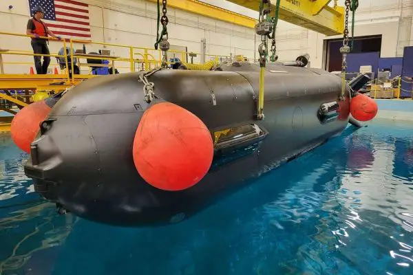 The U.S. Navy’s Orca XLUUV during basin testing illustrates the scale and mission profile of the long-range autonomous undersea vehicles being pursued under the CAMP program for payload delivery, surveillance and operations in contested waters (Picture source: Boeing).