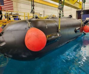 The U.S. Navy’s Orca XLUUV during basin testing illustrates the scale and mission profile of the long-range autonomous undersea vehicles being pursued under the CAMP program for payload delivery, surveillance and operations in contested waters (Picture source: Boeing).