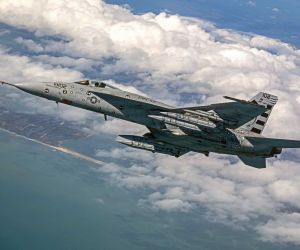 Four AIM-424 Long Range Air-to-Air Missiles are loaded onto a U.S. Navy F/A-18E Super Hornet for testing. The next-generation missile is designed to extend the engagement range, lethality, and defensive reach of Navy and Marine Corps aviation against advanced airborne threats.