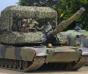 Taiwan is adapting its M1A2T Abrams tanks for drone-intensive warfare with camouflaged overhead protection, rapid field refueling, and dispersed operations designed to improve survivability under persistent aerial surveillance (Picture Source: China Times Group)