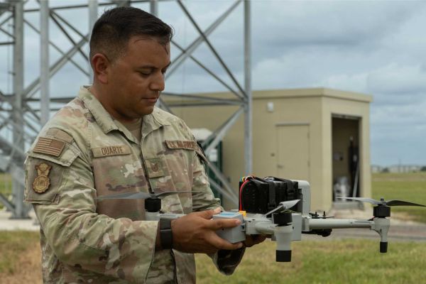 U.S. Air Force Tech. Sgt. Nathan A. Duarte, 6th Security Forces Squadron unmanned aircraft systems program manager, inspects a Bumblebee V2 drone interceptor during counter-drone training at MacDill Air Force Base, Florida.