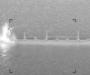 A U.S. military fighter jet conducts a precision strike against the stern of the Panama-flagged M/V Ocean Molica in the Gulf of Oman on October 10, 2026. According to U.S. Central Command, the strike disabled the commercial cargo ship's propulsion system without sinking the vessel or injuring its crew after an alleged violation of the U.S. naval blockade against Iran. (Video source: U.S. Central Command)