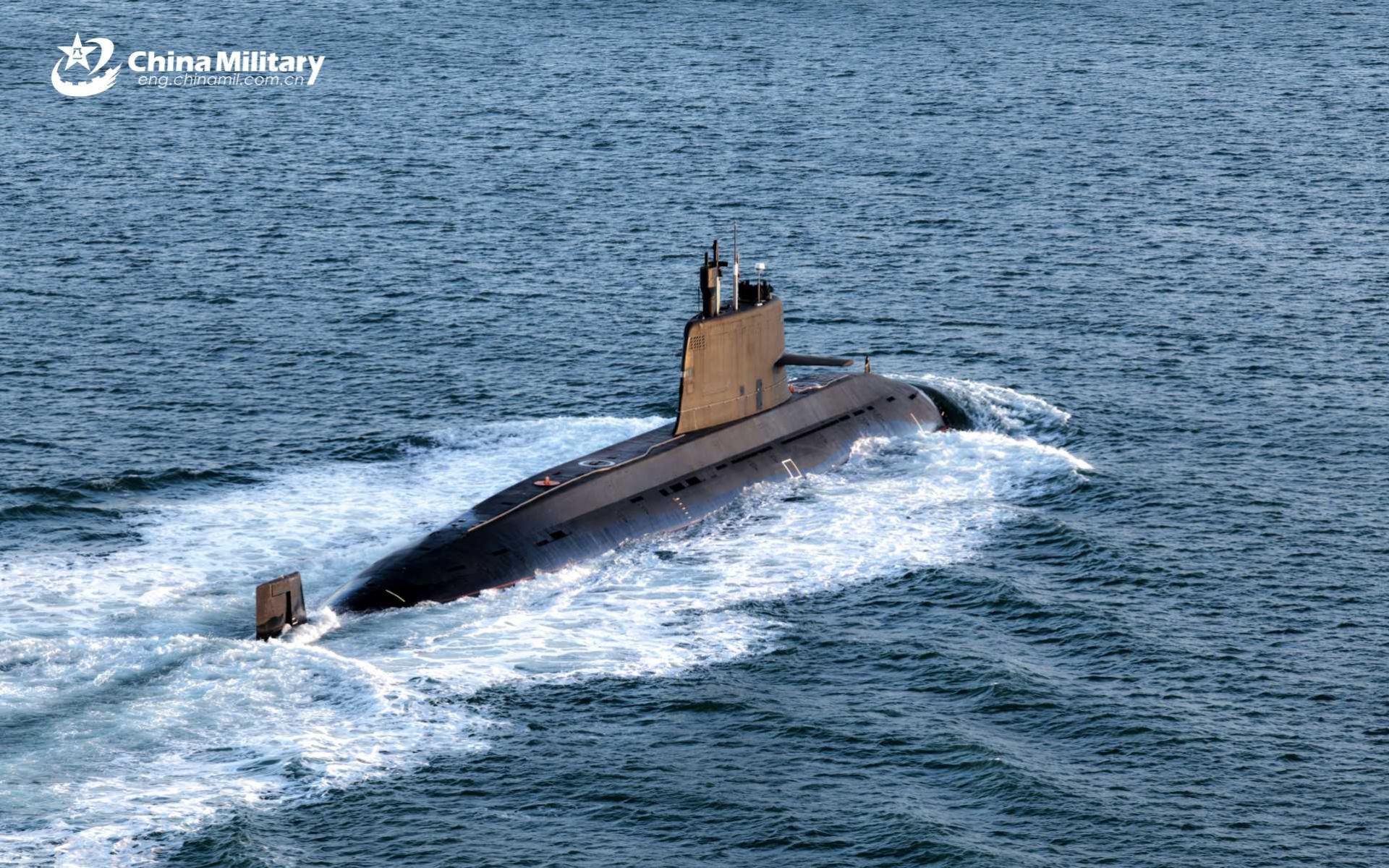 A Chinese People’s Liberation Army Navy nuclear-powered submarine sails during naval operations as China advances nuclear clock technology that could allow future submarines to navigate with extreme precision without GPS, potentially challenging U.S. Navy anti-submarine warfare dominance in the Indo-Pacific region.
