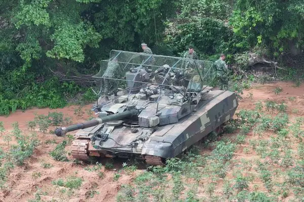 Images appearing to show Royal Thai Army T-84 Oplot-T tanks with foldable overhead mesh suggest Thailand is testing low-cost protection against FPV drone attacks (Picture Source: Social Media)
