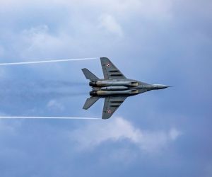 A Polish MiG-29 flies over the Arleigh Burke-class guided-missile destroyer USS Porter during a cooperative exercise with the Polish Navy, March 14, 2023 (Picture source: US DoD)