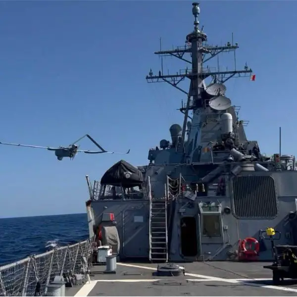 A Textron Systems Aerosonde unmanned aircraft launches from a U.S. Navy vessel during an earlier maritime operation. The U.S. Navy has not identified the unmanned aircraft or the two vessels involved in the August 31, 2026 sea-based ISR support award.