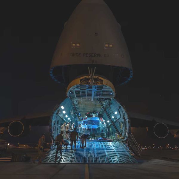 A U.S. Air Force HH-60W Jolly Green II is unloaded from a C-5 Super Galaxy at Camp Lemonnier, Djibouti, on June 10, 2026, marking its deployment to support combat rescue and crisis response missions in East Africa.