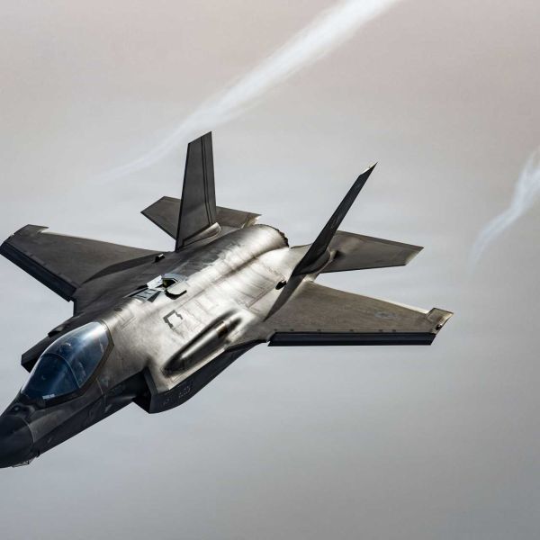 A U.S. Air Force F-35 Lightning II assigned to the 48th Fighter Wing flies over the North Sea during Exercise Point Blank on January 29, 2026. The Pentagon plans to add a Starshield-enabled Beyond Line of Sight satellite communications capability to the F-35 by 2031, allowing the fighter to exchange track data across extended distances for long-range kill-chain management.