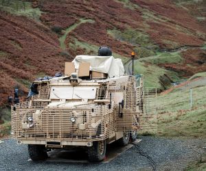 British Army Wolfhound protected mobility vehicle equipped with the high-energy Laser Directed Energy Weapon demonstrator during earlier UK trials. The technology provides a direct precursor to Project PANOPTES, which seeks an autonomous vehicle-mounted counter-UAS capability able to defeat mass drone attacks while preserving conventional missile stocks.