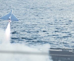 A U.S. military LUCAS (Low-Cost Uncrewed Combat Attack System) one-way attack drone launches from the flight deck of the U.S. Navy Independence-class littoral combat ship USS Santa Barbara (LCS 32) in the Arabian Gulf, demonstrating its potential for ship-based long-range precision strike operations.