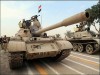 Armée irakienne T-55 irakien char de combat principal photo  . Les forces spéciales et l’armée irakienne ont defile dans les rues de Basora. Pour le N°2 d’Al Quaeda, la décision des britanniques de quitter l’Irak, montre que la résistance n’a jamais été aussi forte. Les forces armées britanniques ont transféré le contrôle de sécurité de la province de Basora à l’armée Irakienne.